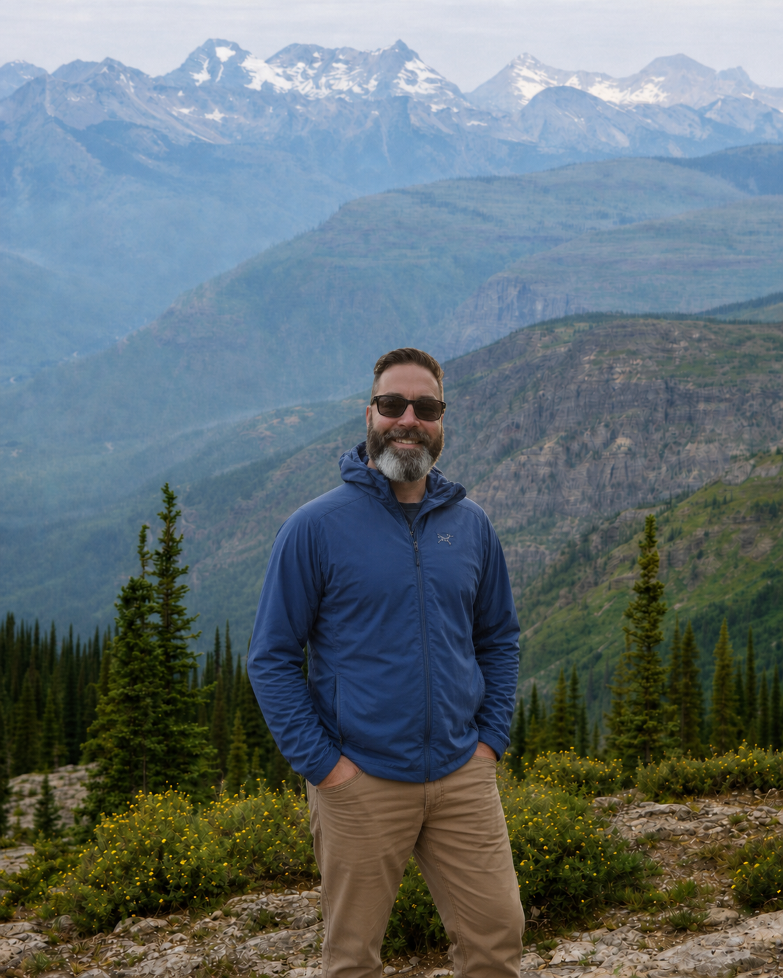 Kyle outdoors at a mountain overlook
